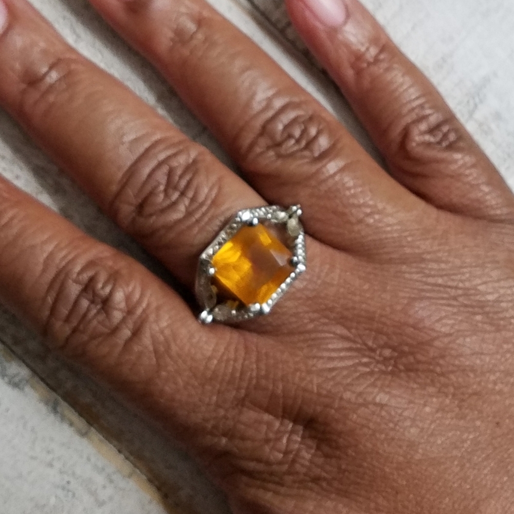 Cocktail ring with tangerine colored gem stone